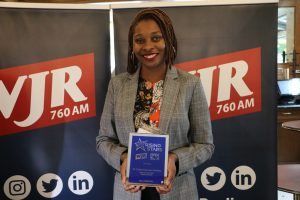 September 27, 2022 ~ “Clearly Female” Founder Dr. Kristin Barnes-Holiday holds her plaque at the 2022 Rising Stars honoree ceremony. Photo: Sean Boeberitz / 760 WJR