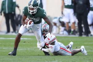 October 8, 2022 ~ Michigan State Spartans wide receiver Tre Mosley is tackled by Ohio State Buckeyes safety Tanner McCalister during first half action at Spartan Stadium. Photo: Kirthmon F. Dozier / USA TODAY NETWORK