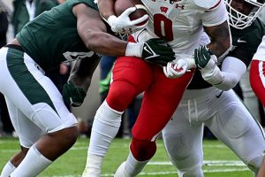 October 15, 2022 ~ Wisconsin Badgers running back Braelon Allen runs around the right end against the Michigan State Spartans at Spartan Stadium. Photo: Dale Young-USA TODAY Sports