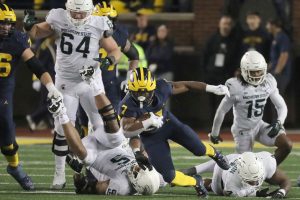 October 29, 2022 ~ Michigan running back Donovan Edwards is tackled by Michigan State defensive end Michael Fletcher during the second half of the Michigan / Michigan State game in Ann Arbor. Photo: Kirthmon F. Dozier / USA TODAY NETWORK