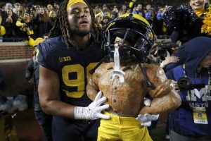 October 29, 2022 ~ Michigan linebacker Mike Morris with the Paul Bunyan Trophy after Michigan's 29-7 win over Michigan State in Ann Arbor. Photo: Kirthmon F. Dozier / USA TODAY NETWORK