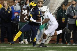 October 29, 2022 ~ Michigan running back Donovan Edwards is tackled by Michigan State linebacker Jacoby Windmon during the first half of the Michigan / Michigan State game in Ann Arbor. Photo: Kirthmon F. Dozier / USA TODAY NETWORK