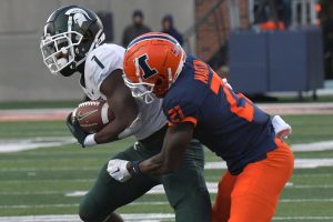 November 5, 2022 ~ Michigan State Spartans wide receiver Jayden Reed is tackled by Illinois Fighting Illini defensive back Jartavius Martin during the second half at Memorial Stadium. Photo: Ron Johnson-USA TODAY Sports