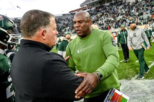 November 12, 2022 ~ Michigan State's head coach Mel Tucker, right, shakes hands with Rutgers' head coach Greg Schiano after the Spartans victory over the Scarlet Knights at Spartans Stadium. Photo: Nick King/Lansing State Journal / USA TODAY NETWORK