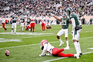 November 12, 2022 ~ Michigan State's Kendell Brooks, center, celebrates after Ameer Speed, right, broke up a pass intended for Rutgers' Sean Ryan during the fourth quarter at Spartans Stadium. Photo: Nick King/Lansing State Journal / USA TODAY NETWORK