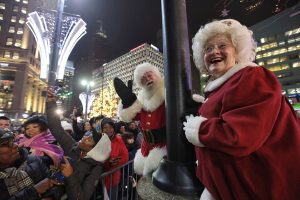 November 16, 2018 ~ Santa Claus and Mrs. Claus wave to the crowd gathered during the annual tree lighting event at Campus Martius Park in Downtown Detroit. Photo: Ryan Garza, Detroit Free Press