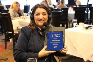 November 19, 2022 ~ The Capital Grille Sales and Marketing Manager Lisa Banish displays her award at the 2022 Women Who Lead Honoree Ceremony inside Joe Muer Seafood in Detroit’s Renaissance Center. Photo: Sean Boeberitz / WJR