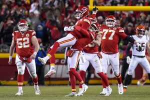 January 29, 2023 ~ Kansas City Chiefs place kicker Harrison Butker is lifted off of his feet after kicking the go-ahead field goal with three seconds remaining in the fourth quarter of the AFC championship NFL game between the Cincinnati Bengals and the Kansas City Chiefs at Arrowhead Stadium in Kansas City. Photo: Sam Greene ~ USA TODAY Sports