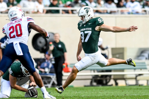 Sept. 9, 2023 ~ Michigan State's Jonathan Kim hits a long field goal against Richmond during the second quarter at Spartan Stadium in East Lansing. Photo: Nick King ~ USA TODAY NETWORK