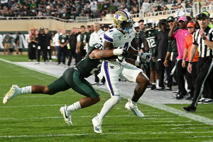 Sept. 16, 2023 ~ Washington Huskies wide receiver Germie Bernard (4) catches the ball before being forced out of bounds by Michigan State Spartans defensive back Dillon Tatum (21) in the third quarter at Spartan Stadium. Photo: Dale Young ~ USA TODAY Sports