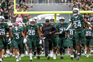 Sept. 16, 2023 ~ Michigan State Interim Head Coach Harlon Barnett and the Spartans take the field before the game against Washington at Spartan Stadium in East Lansing. Photo: Nick King ~ USA TODAY NETWORK