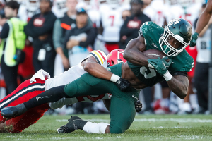 Sept. 23, 2023 ~ Michigan State running back Nathan Carter runs against Maryland defensive back Dante Trader Jr. during the second half of MSU's 31-9 loss on Saturday. Photo: Junfu Han ~ USA TODAY NETWORK