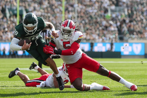 Sept. 23, 2023 ~ Michigan State quarterback Noah Kim (10) is tackled by Maryland defensive lineman Quashon Fuller (5) during the first half at Spartan Stadium in East Lansing. Photo: Junfu Han ~ USA TODAY NETWORK