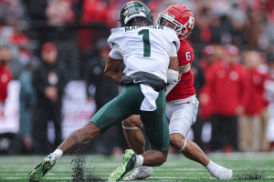 Oct. 14, 2023 ~ Rutgers Scarlet Knights wide receiver Christian Dremel (6) is tackled by Michigan State Spartans defensive back Jaden Mangham (1) during the first half at SHI Stadium. Photo: Vincent Carchietta ~ USA TODAY Sports
