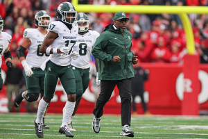 Oct. 14, 2023 ~ Michigan State Spartans interim head coach Harlon Barnett leads his team on to the field before the game against the Rutgers Scarlet Knights at SHI Stadium. Photo: Vincent Carchietta ~ USA TODAY Sports