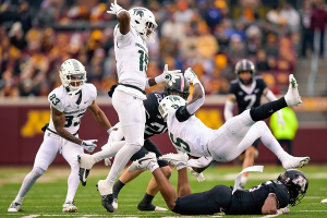 Oct. 28, 2023 ~ Minnesota Golden Gophers defensive back Justin Walley (5) trips up Michigan State University Spartans running back Nate Carter (5) during the third quarter at Huntington Bank Stadium. Photo: Nick Wosika ~ USA TODAY Sports