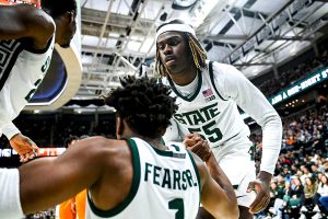 Oct. 29, 2023 ~ Michigan State's Mady Sissoko and Coen Carr help up teammate Jeremy Fears Jr. during the second half of their game against the Tennessee Volunteers at the Breslin Center in East Lansing. Photo: Nick King ~ USA TODAY NETWORK