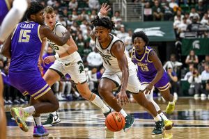 Nov. 6, 2023 ~ Michigan State's A.J. Hoggard moves the ball against James Madison during the second half at the Breslin Center in East Lansing. The Spartans went on to lose 79-76. Photo: Nick King ~ USA TODAY NETWORK