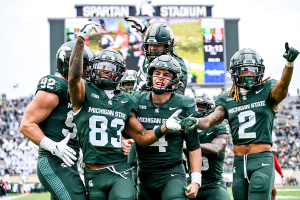Nov. 4, 2023 ~ Michigan State's Montorie Foster Jr. (83) celebrates his touchdown catch with teammates during the fourth quarter in the game against Nebraska at Spartan Stadium. Photo: Nick King ~ USA TODAY NETWORK
