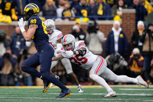 Nov. 25, 2023 ~ Ohio State Buckeyes linebacker Tommy Eichenberg (35) tries to make a tackle on Michigan Wolverines tight end AJ Barner (89) during the second half of the NCAA football game at Michigan Stadium. Photo: Adam Cairns ~ USA TODAY NETWORK