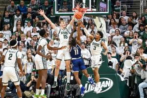 Nov. 28, 2023 ~ Michigan State's Carson Cooper, left, and Jaden Akins, right, block a shot by Georgia Southern's Jamar Franklin during the first half at the Breslin Center in East Lansing. Photo: Nick King ~ USA TODAY NETWORK