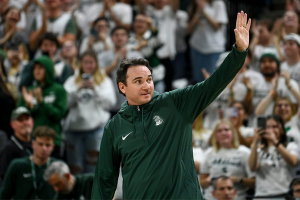Nov. 28, 2023 ~New Michigan State Head Football Coach Jonathan Smith waves to the crowd during a timeout in the basketball game against Georgia Southern at the Breslin Center in East Lansing. Photo: Nick King ~ USA TODAY NETWORK