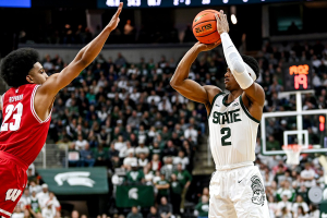Dec. 5, 2023 ~Michigan State's Tyson Walker scores as Wisconsin's Chucky Hepburn defends during the second half at the Breslin Center in East Lansing. Photo: Nick King ~ USA TODAY NETWORK