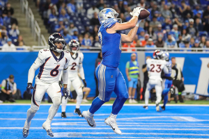 Dec. 16, 2023 ~ Detroit Lions tight end Sam LaPorta (87) makes a catch for a touchdown against Denver Broncos safety P.J. Locke (6) during the second half at Ford Field. Photo: Junfu Han ~ USA TODAY NETWORK