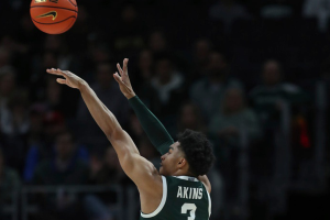Dec. 16, 2023 ~ Michigan State guard Jaden Akins scores against Baylor guard Jayden Nunn during the first half of MSU's 88-64 win over Baylor at Little Caesars Arena. Photo: Kirthmon F. Dozier ~ USA TODAY NETWORK