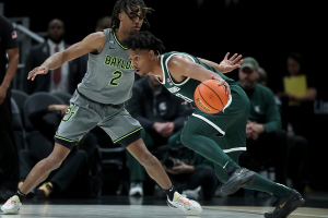 Dec. 16, 2023 ~ Michigan State Spartans guard A.J. Hoggard drives against Baylor Bears guard Jayden Nunn during the first half at Little Caesars Arena. Photo: Kirthmon F. Dozier ~ USA TODAY NETWORK