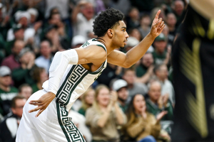 Dec. 18, 2023 ~ Michigan State's Jaden Akins celebrates after a dunk against Oakland during the first half at the Breslin Center in East Lansing. Photo: Nick King ~ USA TODAY NETWORK
