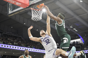 Jan. 7, 2024 ~ Michigan State Spartans forward Coen Carr (55) goes up for a dunk on Northwestern Wildcats forward Blake Preston (32) during the first half at Welsh-Ryan Arena. Photo: David Banks ~ USA TODAY Sports
