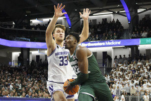Jan. 7, 2024 ~ Northwestern Wildcats forward Luke Hunger (33) defends Michigan State Spartans center Mady Sissoko (22) during the first half at Welsh-Ryan Arena. Photo: David Banks ~ USA TODAY Sports