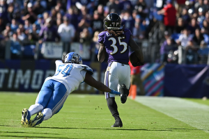 Oct. 22, 2023 ~ Baltimore Ravens running back Gus Edwards (35) runs by a diving Detroit Lions defensive tackle Alim McNeill (54) during the second half at M&T Bank Stadium. Photo: Tommy Gilligan ~ USA TODAY Sports