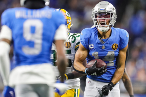 Nov. 23, 2023 ~ Detroit Lions wide receiver Amon-Ra St. Brown celebrates a first down against the Green Bay Packers during the second half at Ford Field. Photo: Junfu Han ~ USA TODAY NETWORK