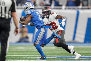 Jan. 21, 2024 ~ Detroit Lions safety C.J. Gardner-Johnson (2) intercepts a pass from Tampa Bay Buccaneers quarterback Baker Mayfield (6) and runs against Tampa Bay Buccaneers running back Chase Edmonds (22) during the first half of the NFC divisional round at Ford Field in Detroit on Sunday, Jan. 21. 2024.