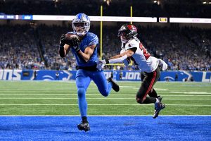 Jan 21, 2024 ~ Detroit Lions wide receiver Amon-Ra St. Brown (14) makes a catch for a touchdown against Tampa Bay Buccaneers cornerback Zyon McCollum (27) during the second half in a 2024 NFC divisional round game at Ford Field. Photo: Lon Horwedel ~ USA TODAY Sports