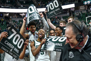 Jan 30, 2024 ~ Michigan State‘s head coach Tom Izzo gives a postgame interview as players celebrate his 700th win after the Spartans beat Michigan at the Breslin Center in East Lansing. Photo: Nick King ~ USA TODAY NETWORK