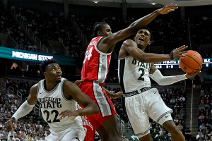 Feb 25, 2024 ~ Michigan State Spartans guard Tyson Walker goes to the basket against Ohio State Buckeyes center Felix Okpara during the second half at Jack Breslin Student Events Center. Photo: Dale Young ~ USA TODAY Sports