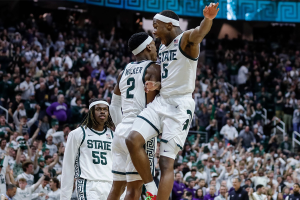 March 6, 2024 ~ Michigan State guard Tyson Walker and guard Tre Holloman celebrate the 53-49 win over Northwestern on Senior Night at Breslin Center in East Lansing. Photo: Junfu Han ~ USA TODAY NETWORK