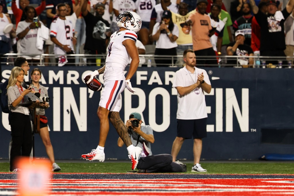 Tetairoa McMillan goes off for 304 yards, No. 21 Wildcats outlast New Mexico