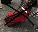 Woman Uses Some Muscle To Prove Her Suitcase Was Small Enough To Be A ‘Carry-On’! VIDEO: