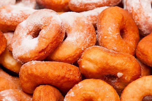 donuts with powdered sugar as a background