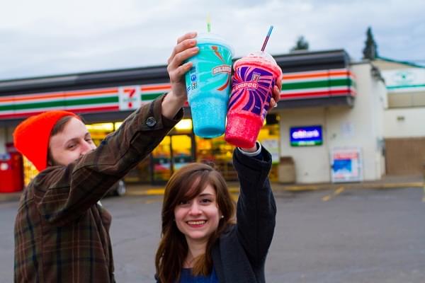 engaged couple with slurpees at a 7 Eleven
