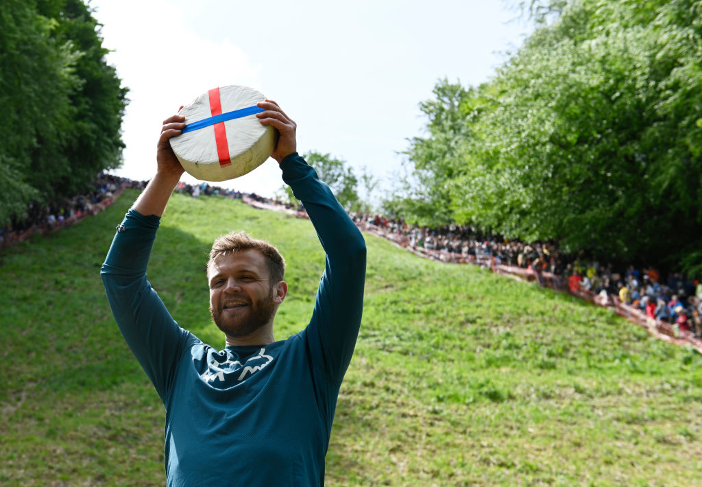 Woman Knocked Unconscious By Rolling Cheese Wedge Wins Cheese Rolling Competition