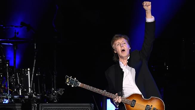 Ringo Starr joins Paul McCartney and Ronnie Wood from the Rolling Stones on stage to perform “Get Back”