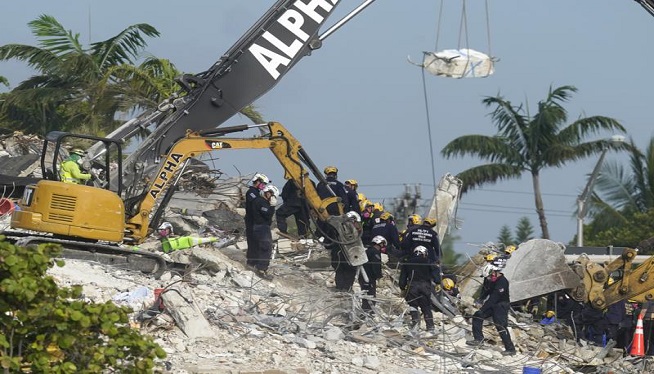 Additional victim found in condo rubble; death toll rises to 28