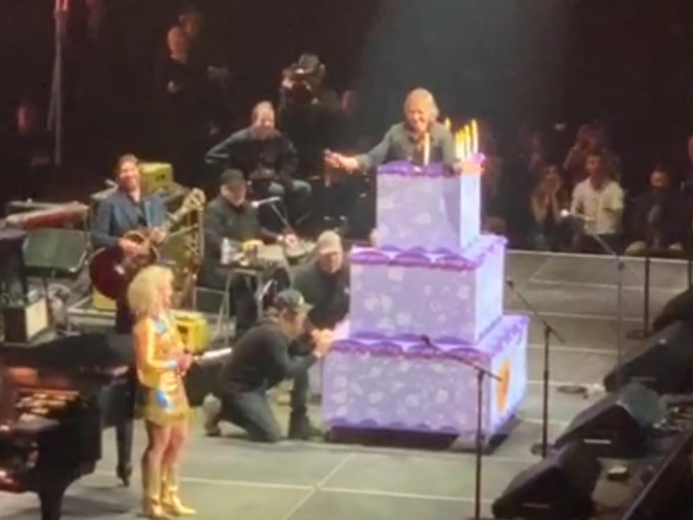 Watch Keith Urban Jump Out of a Cake to Fulfill Loretta Lynn’s Birthday Wish