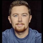 Scotty McCreery Takes The Polar Plunge With Moose Following Him In
