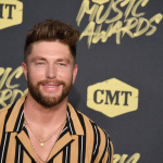 WATCH: Chris Lane Rescuing His Dogs from a Back Yard Skunk